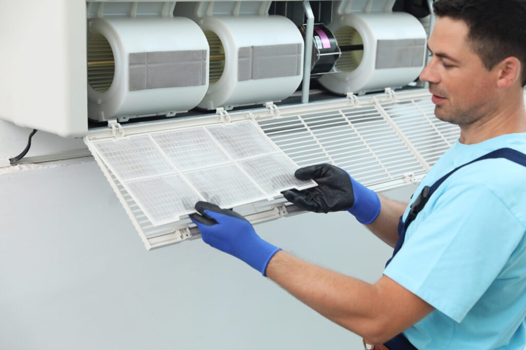 male technician cleaning air conditioner indoors 2026 03 27 02 12 46 utc scaled.jpg